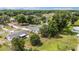 Aerial view of a home with a fenced yard and mature trees at 11153 Sw 79Th Ave, Ocala, FL 34476