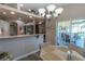 Eat-in dining area adjacent to the kitchen with sliding glass doors to the lanai and outdoor living space at 1213 Meadowbend Dr, Leesburg, FL 34748