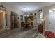 Dining area with wood flooring, chandelier, display cabinet and stylish decor at 1213 Meadowbend Dr, Leesburg, FL 34748