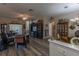Cozy living room with wood floors and decorative furnishings for relaxing and entertaining guests at 1213 Meadowbend Dr, Leesburg, FL 34748