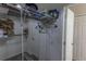 Walk-in closet featuring white wire shelves, hanging racks, and ample storage space at 1213 Meadowbend Dr, Leesburg, FL 34748