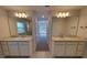 Luxurious bathroom features double sinks and large mirrors at 13154 Sw 69Th Ct, Ocala, FL 34473