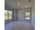 Neutral bedroom showcasing tile floors, recessed lighting, and two windows at 13154 Sw 69Th Ct, Ocala, FL 34473