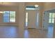 Bright entryway featuring high ceilings, tile floors, and glass sidelight windows at 13154 Sw 69Th Ct, Ocala, FL 34473