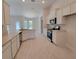 Modern kitchen with stainless steel appliances, white cabinets, and tile floors at 13154 Sw 69Th Ct, Ocala, FL 34473