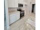 Spacious kitchen featuring stainless steel appliances and granite countertops at 13154 Sw 69Th Ct, Ocala, FL 34473