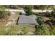 Aerial view of a single Gathering home with a backyard, surrounding wooded area, and newly installed grey roof at 13164 Sw 78Th Place, Dunnellon, FL 34432