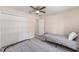 A cozy bedroom with twin beds, a ceiling fan, and wood-look flooring at 13164 Sw 78Th Place, Dunnellon, FL 34432