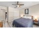 Relaxing bedroom featuring wood-look floors, a queen bed, and modern furniture at 13164 Sw 78Th Place, Dunnellon, FL 34432