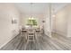 Inviting dining room with a round table set, a window letting in natural light, and neutral decor at 13164 Sw 78Th Place, Dunnellon, FL 34432