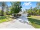 Charming single-story home with stone accents, a two-car garage, and a long driveway at 13164 Sw 78Th Place, Dunnellon, FL 34432