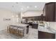 Well-equipped kitchen with an island, barstool seating, stainless steel appliances, and plenty of cabinet space at 13164 Sw 78Th Place, Dunnellon, FL 34432