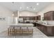 Spacious kitchen features an island with seating, stainless steel appliances, granite countertops, and ample cabinetry at 13164 Sw 78Th Place, Dunnellon, FL 34432