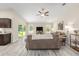 View of open-concept living room featuring vaulted ceiling, modern flooring, and neutral paint at 13164 Sw 78Th Place, Dunnellon, FL 34432