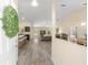 Open concept living space featuring eat-in kitchen, modern gray floors, and lots of natural light at 13164 Sw 78Th Place, Dunnellon, FL 34432