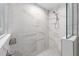 Walk-in shower features large marble tiles and a frameless glass enclosure at 13164 Sw 78Th Place, Dunnellon, FL 34432