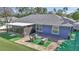 Aerial view of home featuring a backyard, screen room and outdoor seating area at 13800 Sw 33Rd Court Rd, Ocala, FL 34473