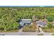 High-angle view showing the home's placement, surrounding foliage and nearby properties at 13800 Sw 33Rd Court Rd, Ocala, FL 34473
