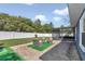 Backyard patio area with outdoor seating, screened lanai, and privacy fence creating a private space at 13800 Sw 33Rd Court Rd, Ocala, FL 34473