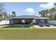 A manicured backyard with new sod and an outdoor seating area at 13800 Sw 33Rd Court Rd, Ocala, FL 34473
