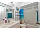 A cozy bathroom with a sink, shower, and ocean themed art at 13800 Sw 33Rd Court Rd, Ocala, FL 34473