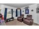 Comfortable bedroom with two recliner chairs, perfect for relaxing and unwinding at 13800 Sw 33Rd Court Rd, Ocala, FL 34473