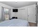 This bedroom showcases a bed, window, and closet space at 13800 Sw 33Rd Court Rd, Ocala, FL 34473