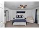 Cozy bedroom with a ceiling fan and a comfortable seating area at 13800 Sw 33Rd Court Rd, Ocala, FL 34473