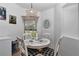 Bright breakfast nook with white table and black and white chairs, perfect for casual dining at 13800 Sw 33Rd Court Rd, Ocala, FL 34473