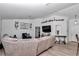 Open-concept living room featuring sleek wood-look floors, high ceilings and a modern aesthetic at 13800 Sw 33Rd Court Rd, Ocala, FL 34473