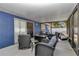 Enclosed patio featuring sliding glass door, patio furniture and screening at 13800 Sw 33Rd Court Rd, Ocala, FL 34473