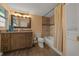 Bathroom with a new vanity, tile backsplash, and tub with a shower at 14190 Ne 209Th Ct, Fort Mc Coy, FL 32134