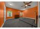 Bedroom with a ceiling fan and windows that let in lots of light at 14190 Ne 209Th Ct, Fort Mc Coy, FL 32134