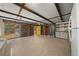 Large living room with wood floor and ceiling with ceiling beams and lots of wall decor at 14190 Ne 209Th Ct, Fort Mc Coy, FL 32134