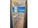 Bright bathroom with a white vanity, tile flooring, and a shower/tub combo at 1441 Admiral Nimitz Ave, Daytona Beach, FL 32124