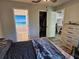 Bedroom featuring wood-look floors, access to closet and bathroom at 1441 Admiral Nimitz Ave, Daytona Beach, FL 32124