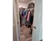 Walk-in closet with built-in shelving and hanging rods, providing ample storage space at 1441 Admiral Nimitz Ave, Daytona Beach, FL 32124