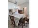 Cozy dining area featuring tile floors, a pass through to the kitchen, and natural lighting at 1441 Admiral Nimitz Ave, Daytona Beach, FL 32124