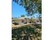 Cozy single-story home with a spacious lawn, mature trees, and a charming, landscaped front yard at 1441 Admiral Nimitz Ave, Daytona Beach, FL 32124