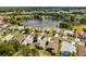 An aerial view of the neighborhood, showcasing the pond, trees, and well-maintained homes at 15426 Sw 14Th Avenue Rd, Ocala, FL 34473