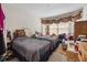 Comfortable bedroom with windows and carpet flooring at 15426 Sw 14Th Avenue Rd, Ocala, FL 34473