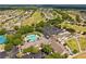 Aerial view of community, highlighting the pool, golf course, recreation center and neighborhood homes at 15426 Sw 14Th Avenue Rd, Ocala, FL 34473