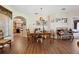 Charming dining area with an arched entry to the kitchen, featuring wood-look floors at 15426 Sw 14Th Avenue Rd, Ocala, FL 34473