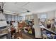 A cluttered garage filled with various items and a closed garage door at 15426 Sw 14Th Avenue Rd, Ocala, FL 34473