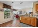 Cozy kitchen with wood cabinets, double sinks, and bright natural light at 15426 Sw 14Th Avenue Rd, Ocala, FL 34473