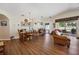 Open floor plan of a charming dining area and living room with wood-look floors at 15426 Sw 14Th Avenue Rd, Ocala, FL 34473