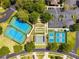 Aerial view of tennis courts, shuffleboard and playground in landscaped community at 15426 Sw 14Th Avenue Rd, Ocala, FL 34473