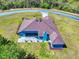 Single-story home boasting verdant lawn, and an outdoor patio, nestled on a spacious lot with private, wooded landscaping at 17901 Sw 25Th Avenue Rd, Ocala, FL 34473