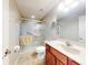 Clean bathroom featuring a glass-enclosed shower, toilet, and a vanity with a sink at 17901 Sw 25Th Avenue Rd, Ocala, FL 34473