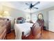 Inviting bedroom with wood furnishings, complemented by natural light streaming through the windows at 17901 Sw 25Th Avenue Rd, Ocala, FL 34473